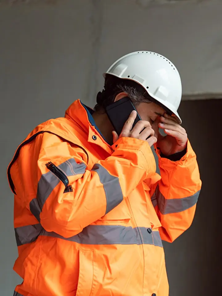 Construction worker on the phone