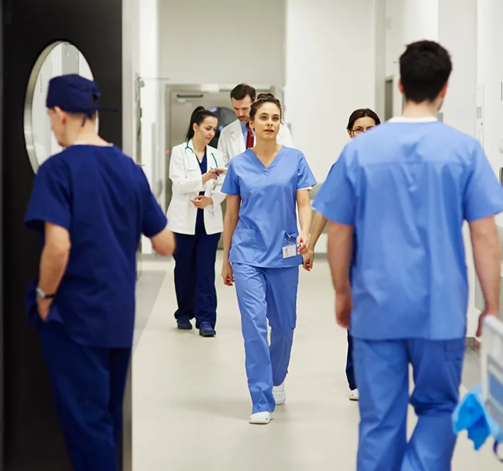 Nurses and doctors in a hospital hallway