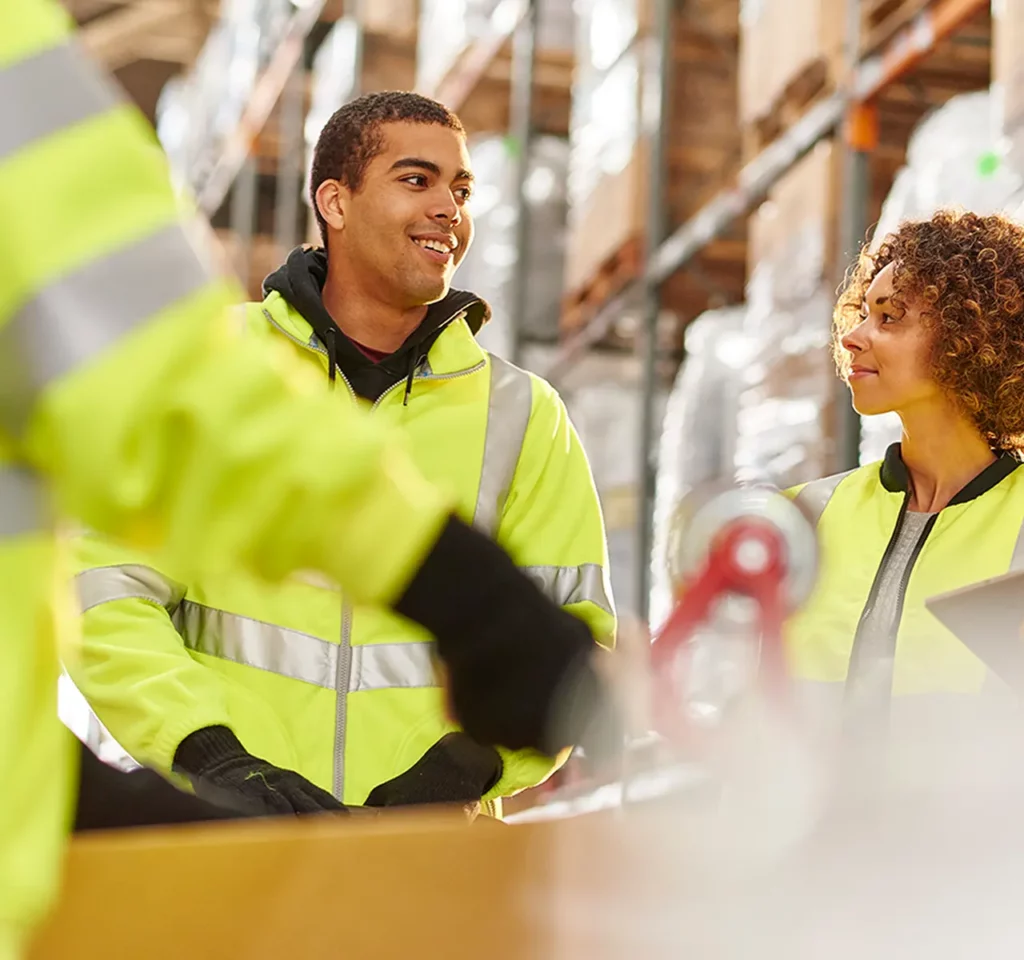 Warehouse workers talking