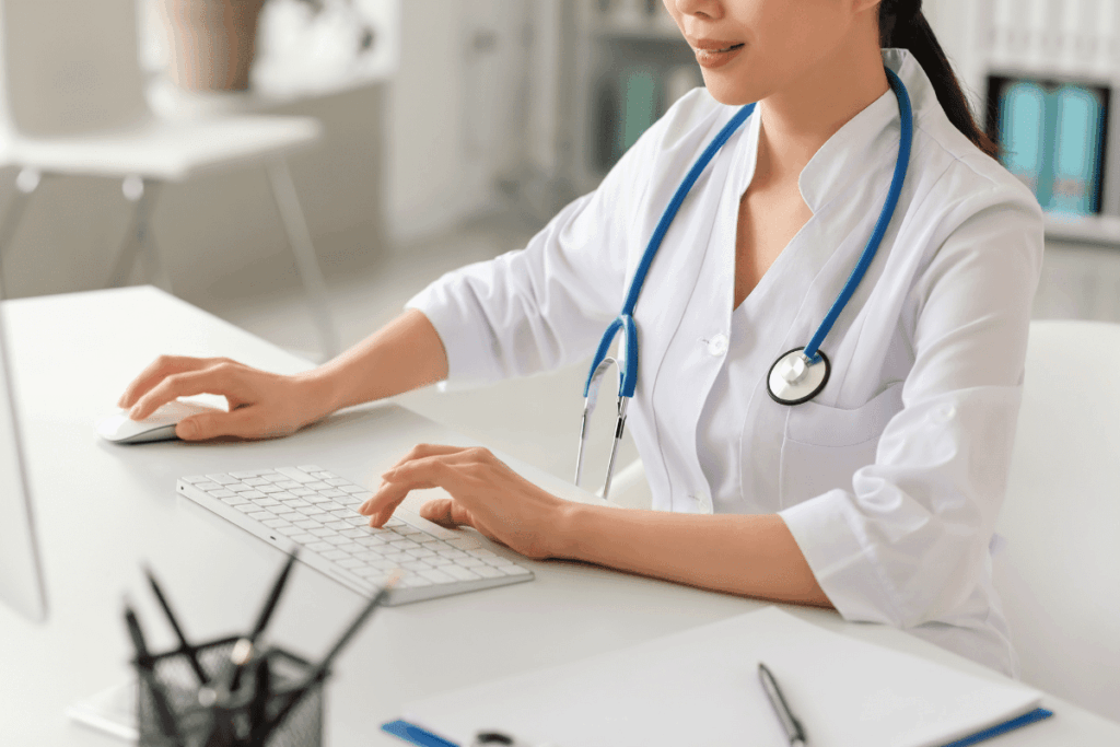 Doctor at her computer at work