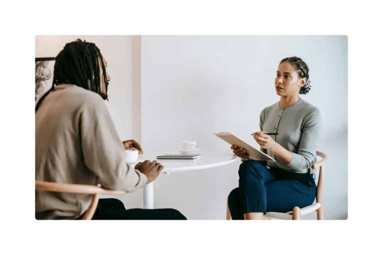 2 co-workers talking