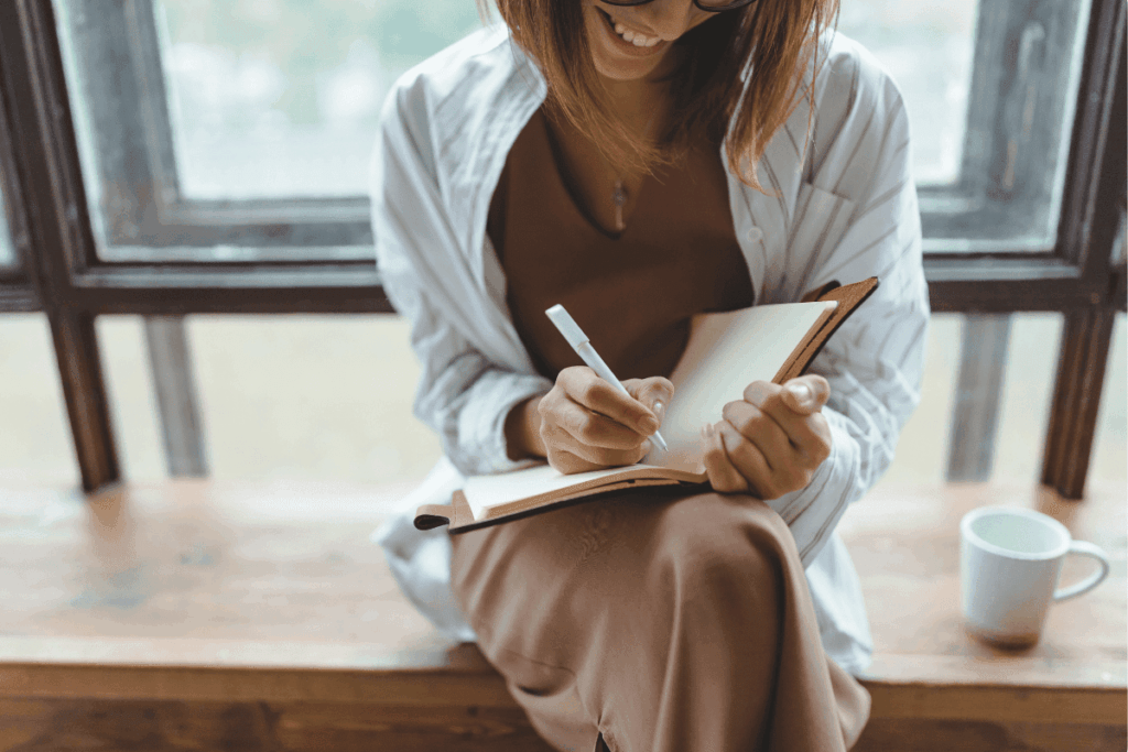 Woman writing on a notebook