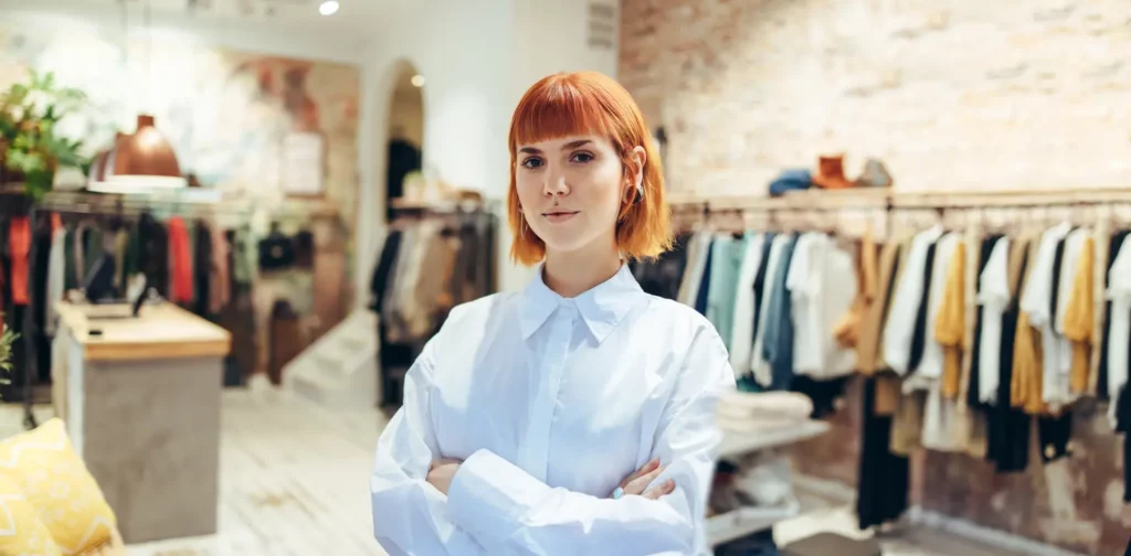 Female retail worker posing for a photo