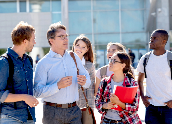 5-roles-universities-lecturer-outside-with-students
