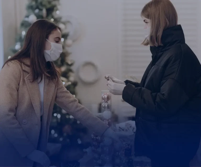 Customer and retail assistant in a shop