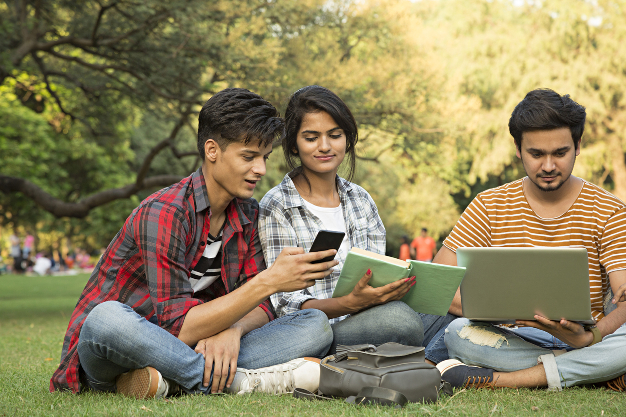 Indian students talking and studying together.
