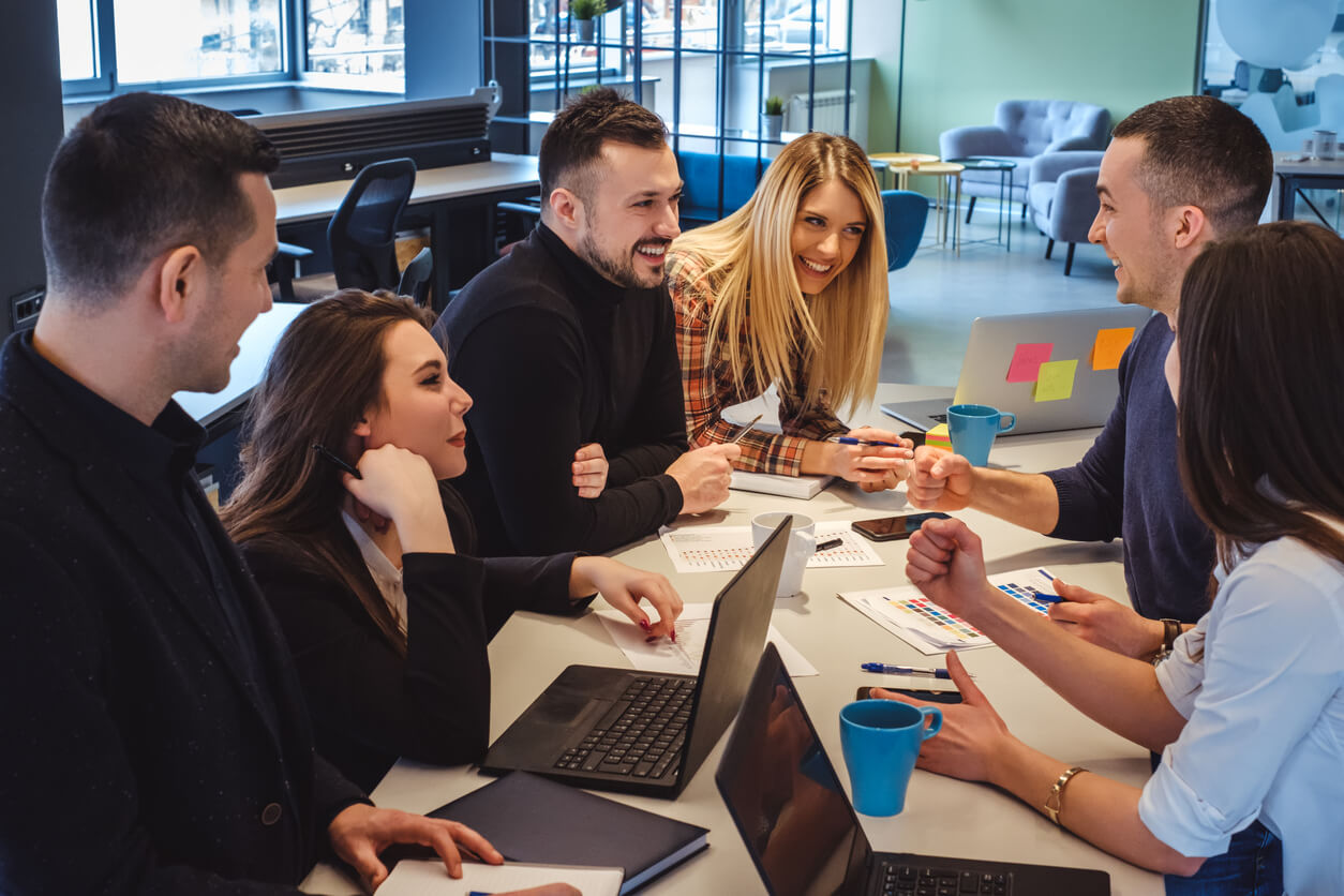 Workplace-wellbeing-young-colleagues-around-a-table