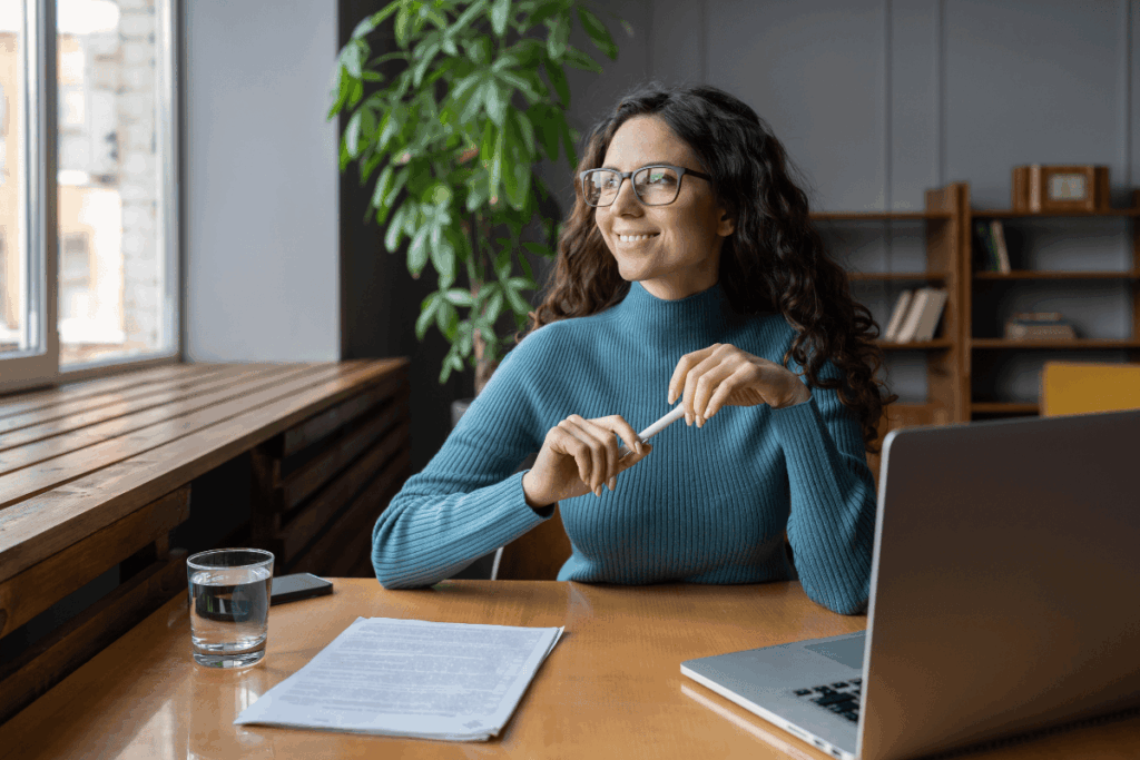 Woman working at her desk with her laptop