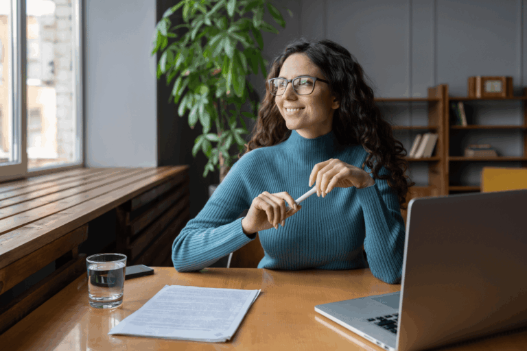 Woman working at her desk with her laptop
