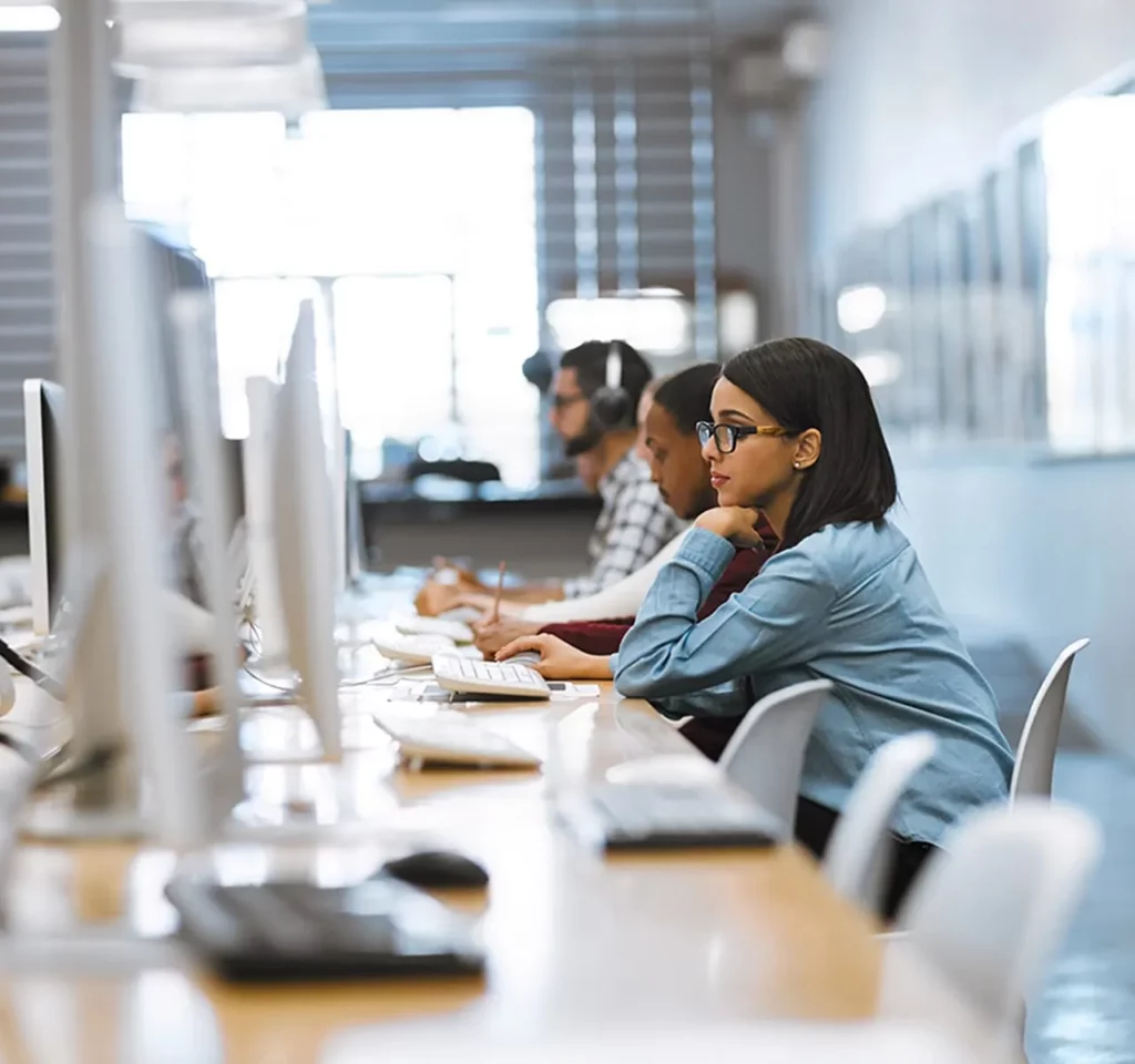 Workers in an office at their computers