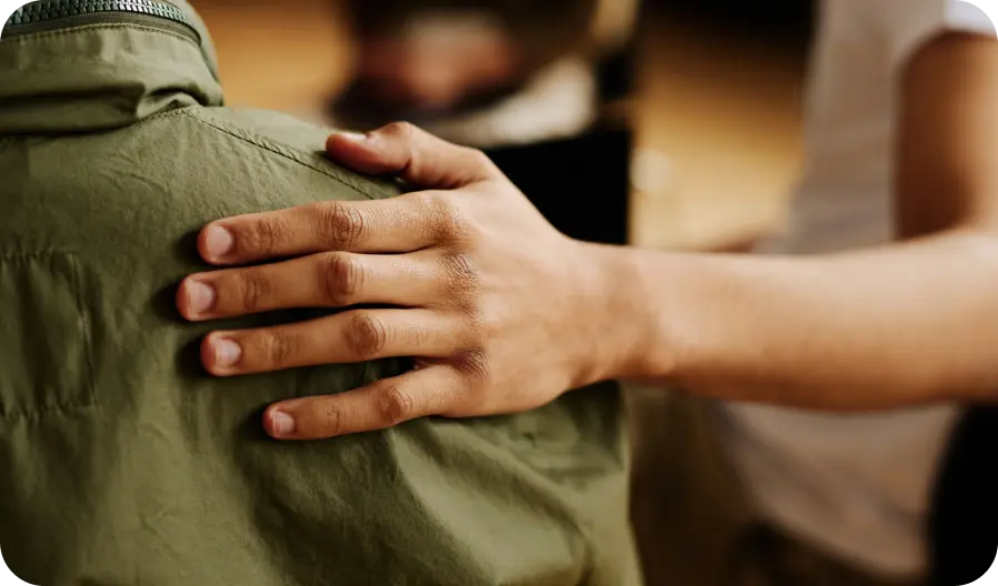 Image of someone comforting a co-worker