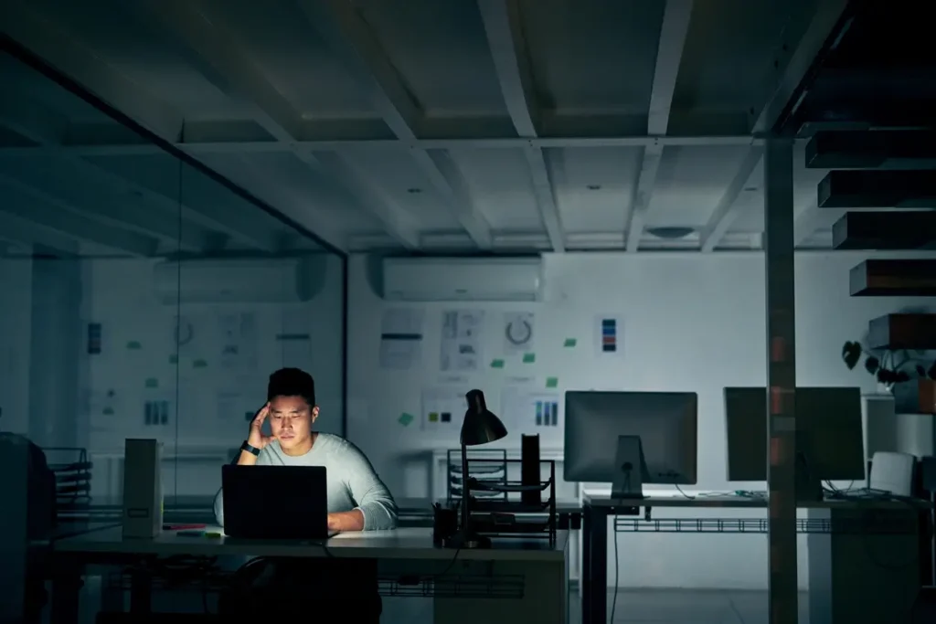 Pensative man at his desk at work