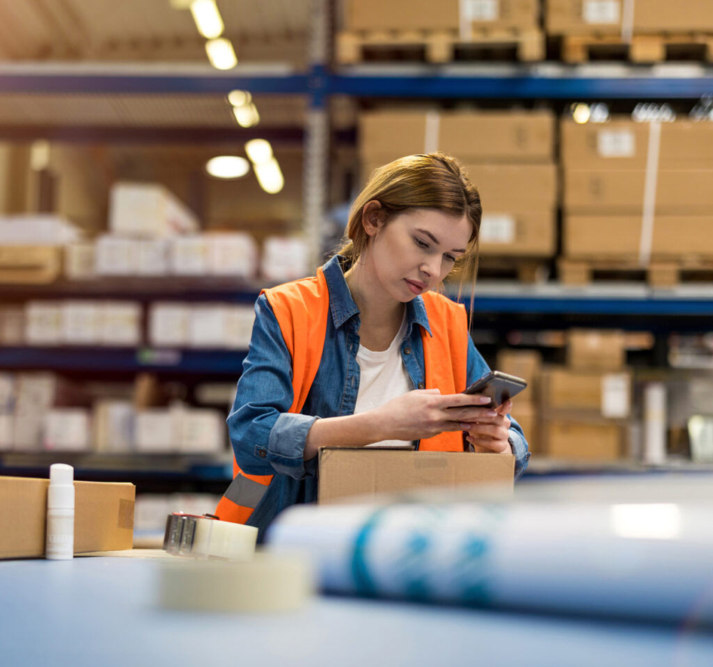 Manufacturing worker on her phone