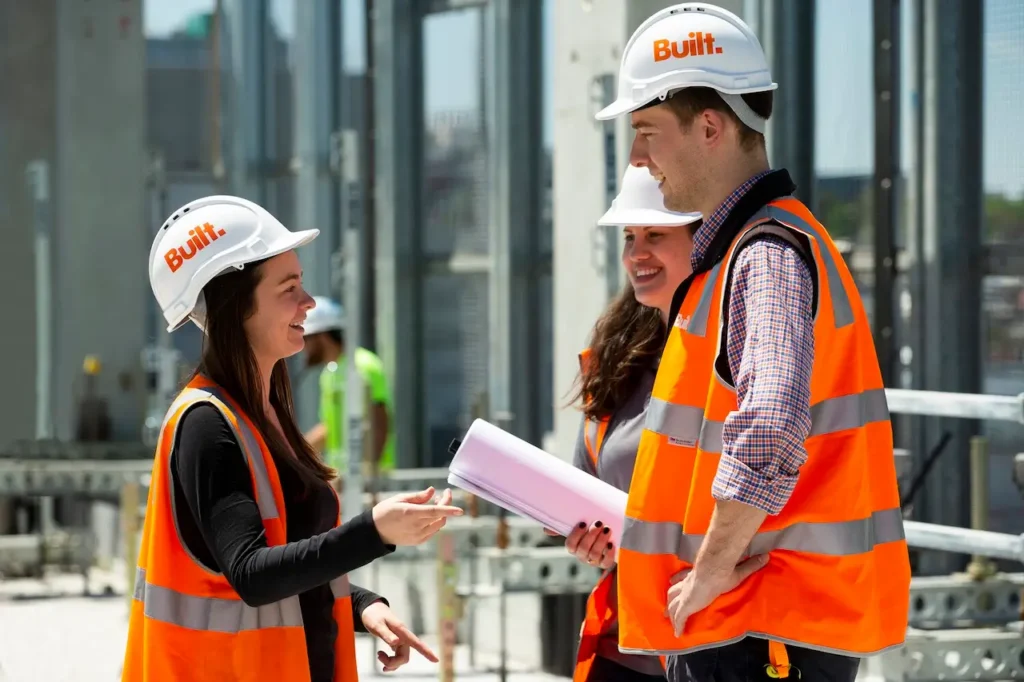 Construction workers talking at a site