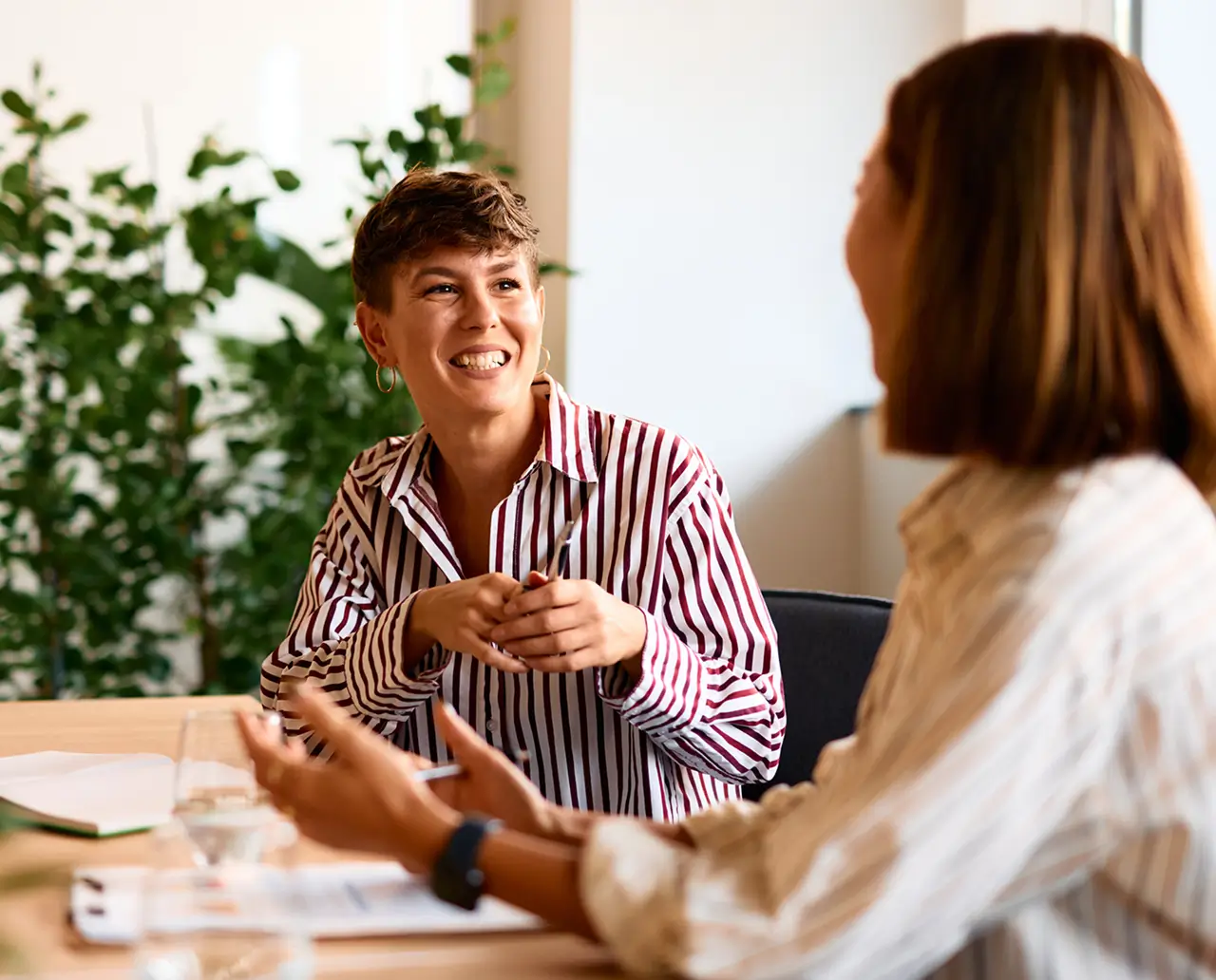 Two women talking at work